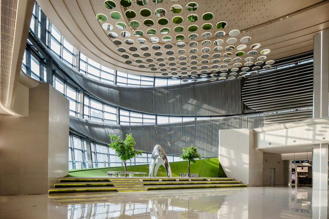 Bright modern office reception area with plants