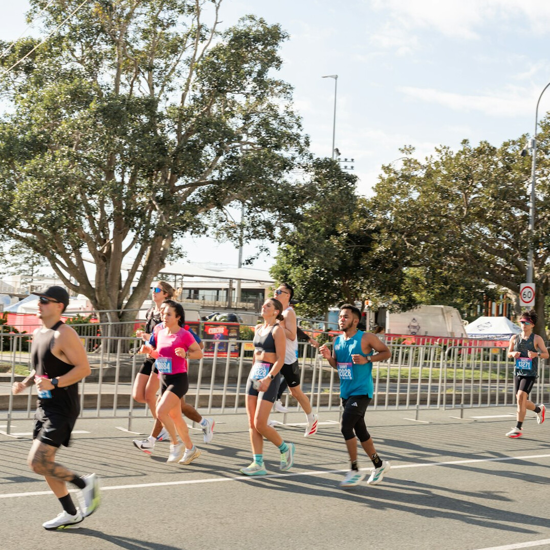 Group fitness class exercising together outdoors